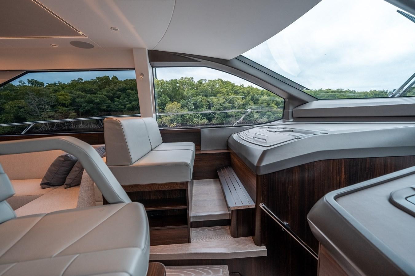 a boat with a desk and chairs aboard MANHATTAN 68 Yacht for Sale