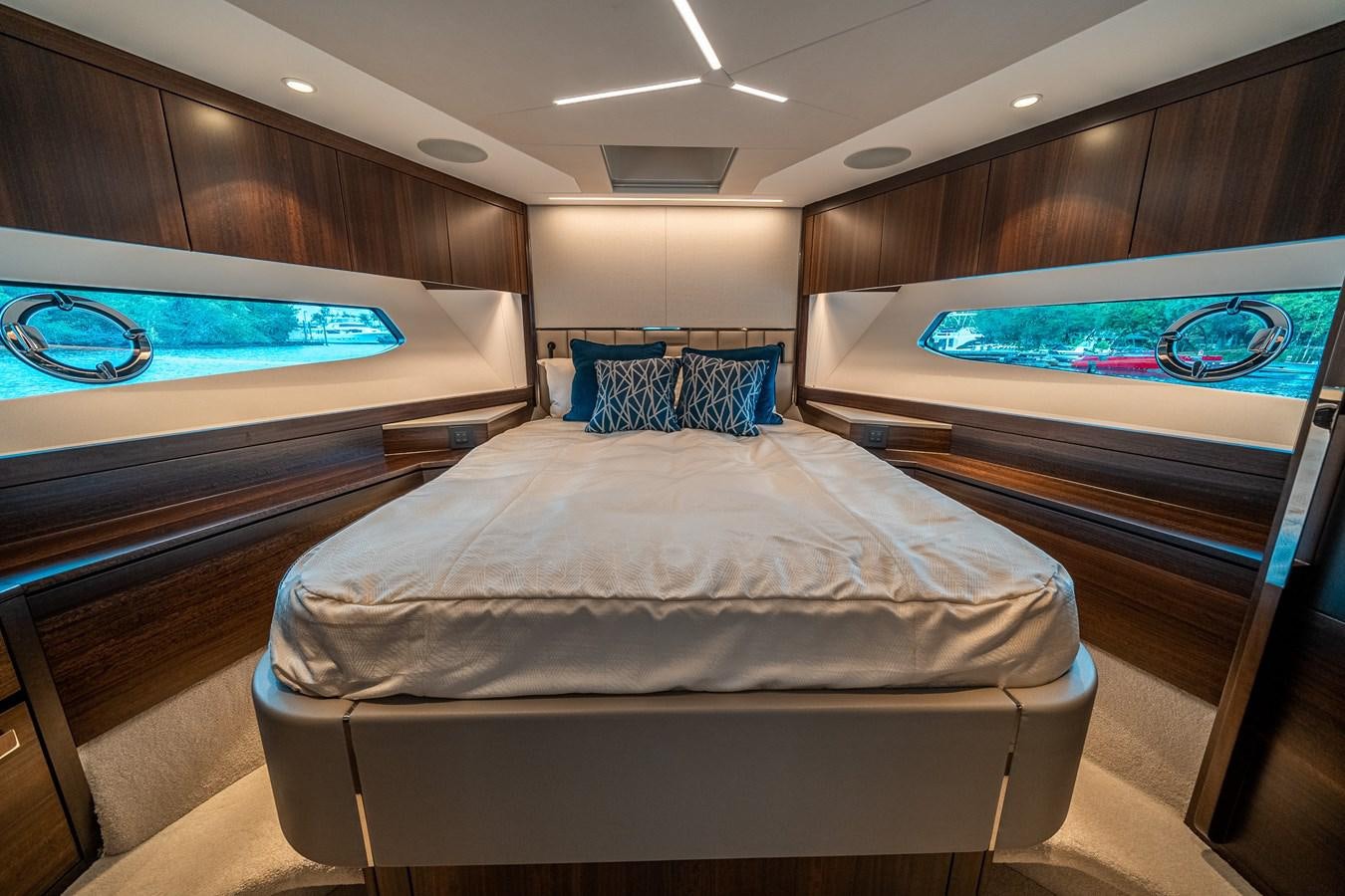 a room with a bed and a television aboard MANHATTAN 68 Yacht for Sale
