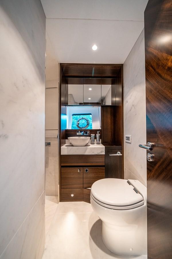 a bathroom with a large mirror aboard MANHATTAN 68 Yacht for Sale