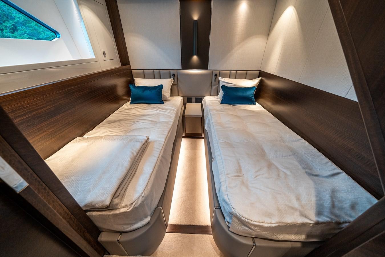 a room with two beds aboard MANHATTAN 68 Yacht for Sale