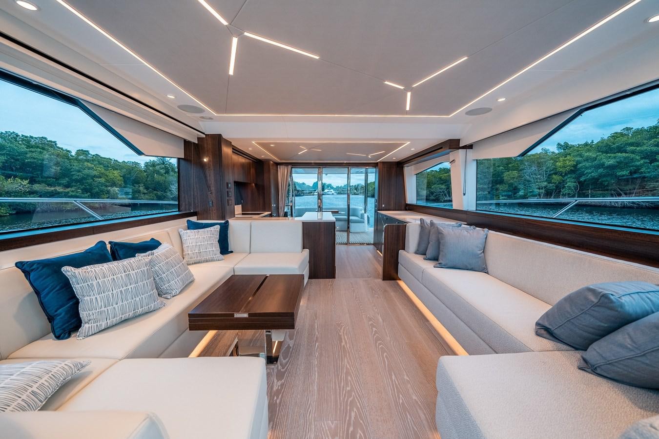 a living room with a large window aboard MANHATTAN 68 Yacht for Sale