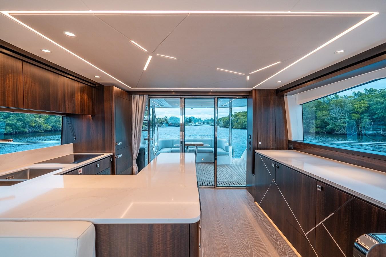 a room with a large window and a view of the water aboard MANHATTAN 68 Yacht for Sale