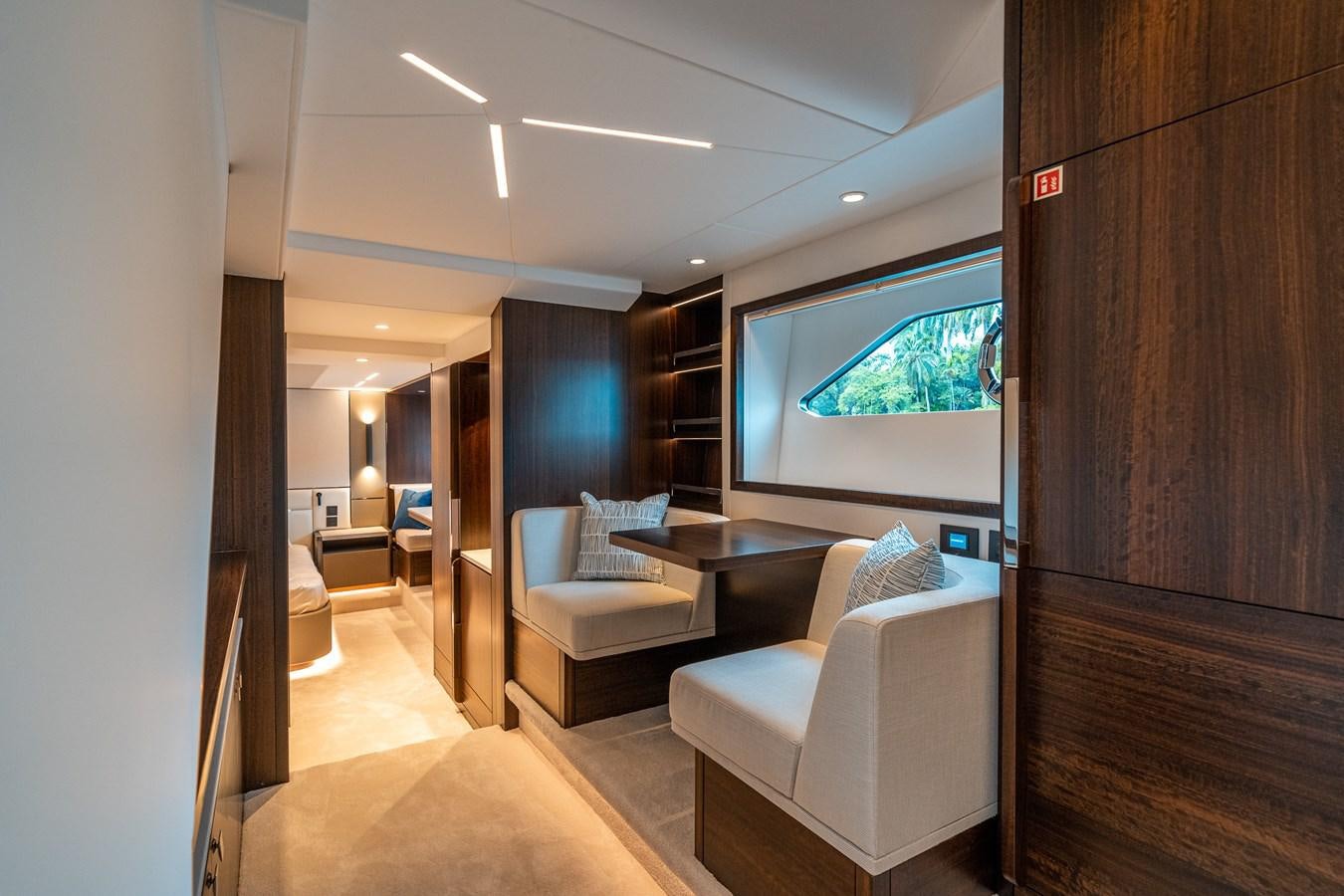 a room with a table and chairs aboard MANHATTAN 68 Yacht for Sale