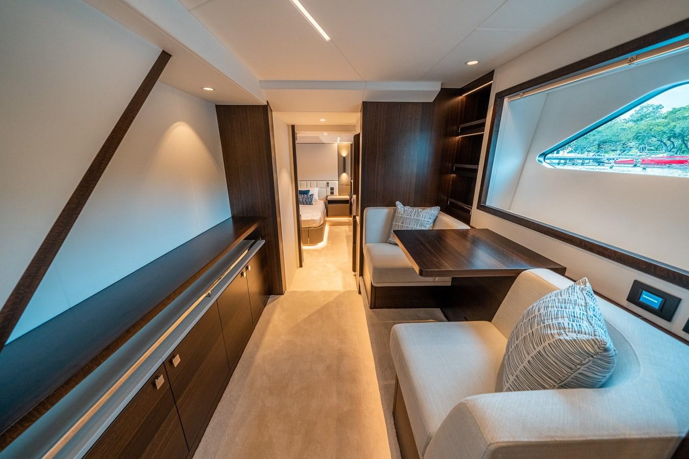 a living room with a large screen aboard MANHATTAN 68 Yacht for Sale