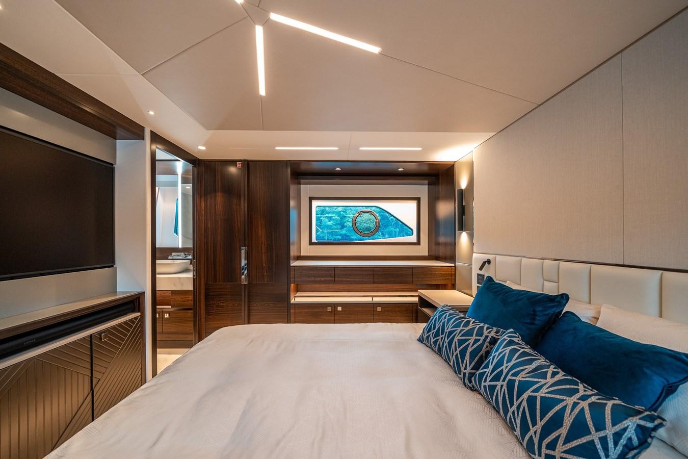 a bedroom with a large television aboard MANHATTAN 68 Yacht for Sale