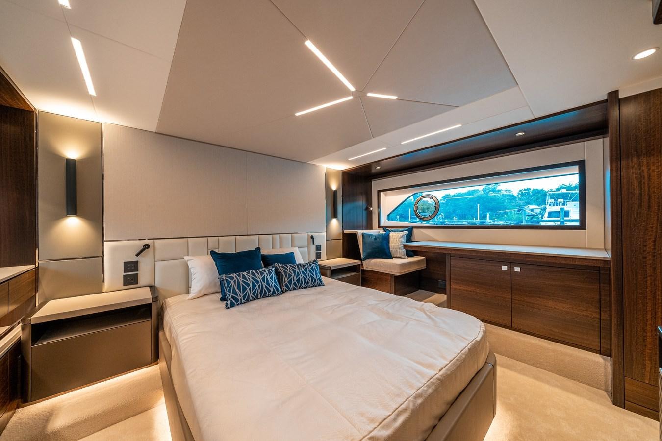 a hotel room with a bed and a desk aboard MANHATTAN 68 Yacht for Sale