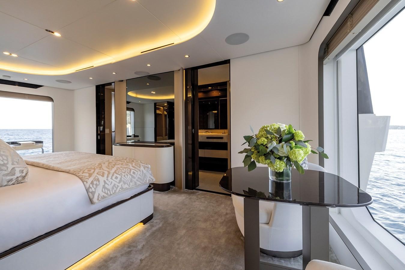 a hotel room with a bed and a table aboard AZIMUT GRANDE 32M  Yacht for Sale