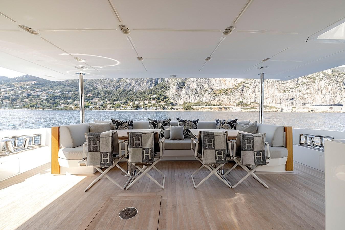 a room with a table and chairs aboard AZIMUT GRANDE 32M  Yacht for Sale