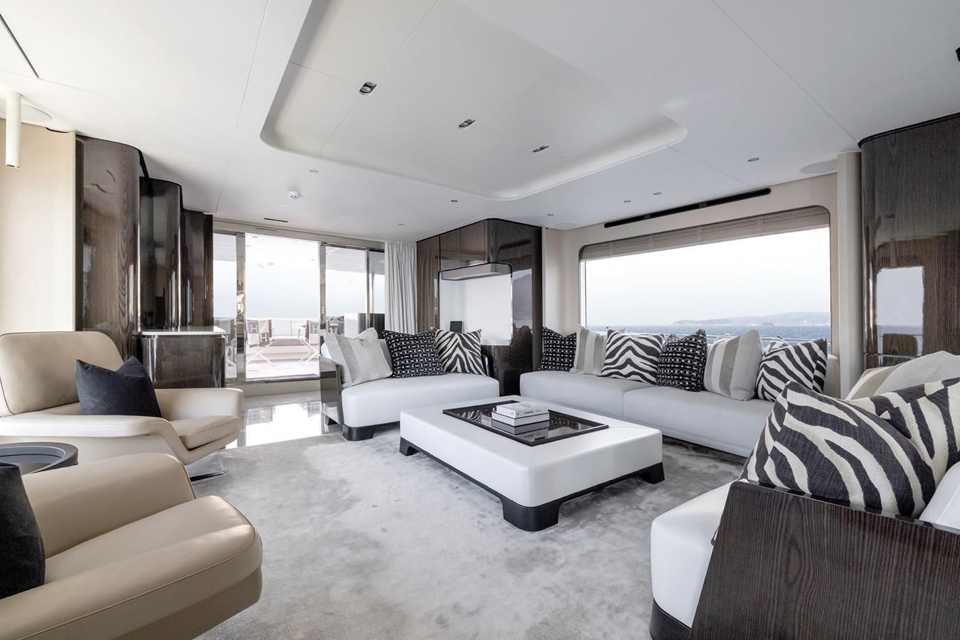 a living room with white furniture aboard AZIMUT GRANDE 32M  Yacht for Sale
