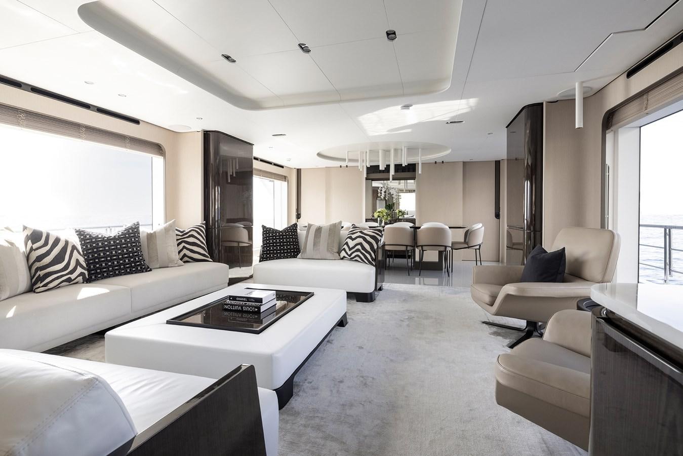 a living room with white furniture aboard AZIMUT GRANDE 32M  Yacht for Sale