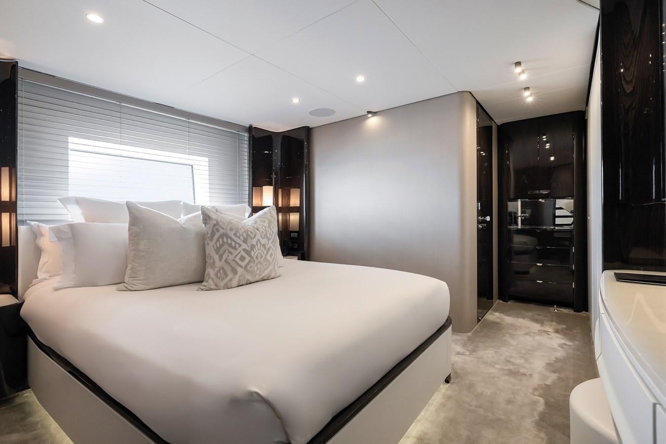 a large bed in a hotel room aboard AZIMUT GRANDE 32M  Yacht for Sale