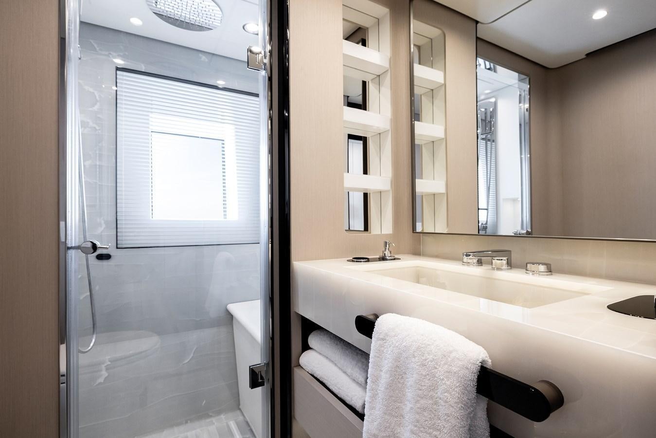 a bathroom with a bathtub and sink aboard AZIMUT GRANDE 32M  Yacht for Sale