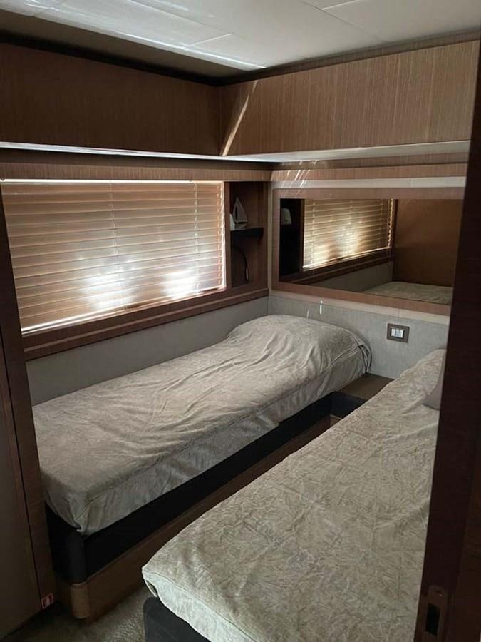a room with a bed and a window aboard SKYFALL Yacht for Sale