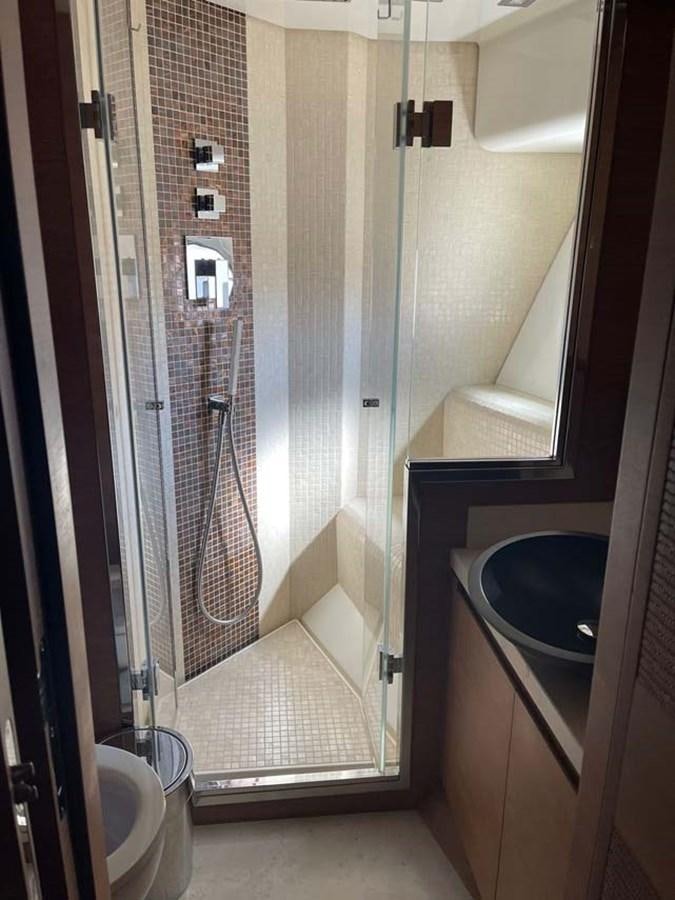 a bathroom with a sink and shower aboard SKYFALL Yacht for Sale