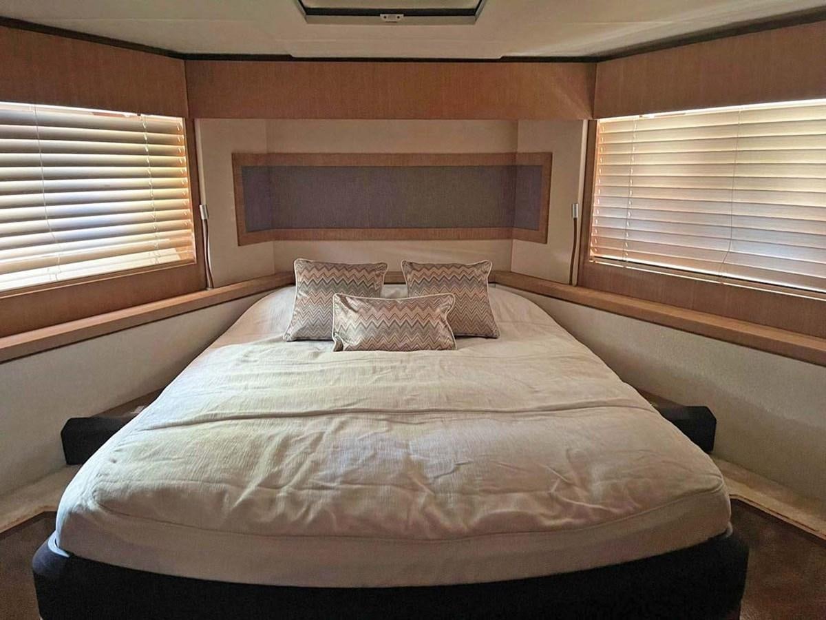 a bed with pillows aboard SKYFALL Yacht for Sale