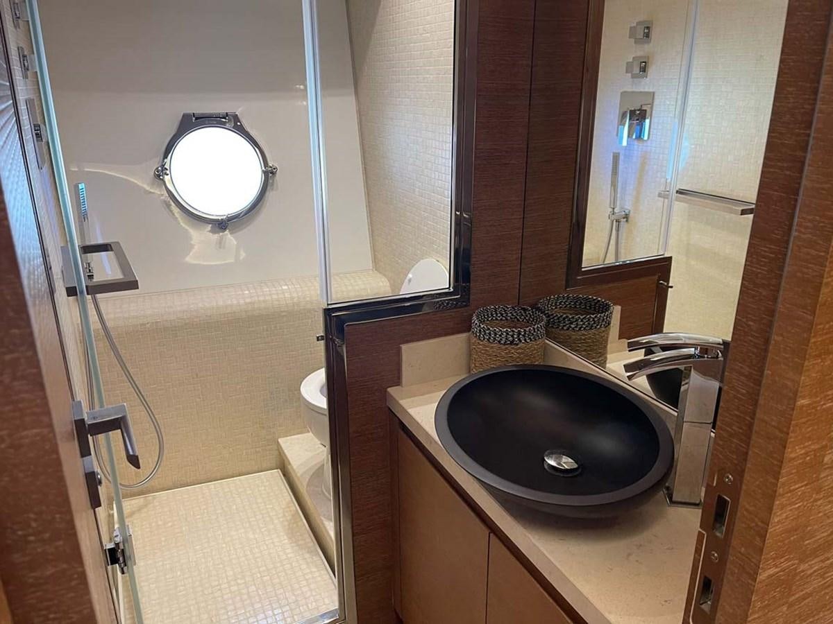 a bathroom with a sink and a mirror aboard SKYFALL Yacht for Sale