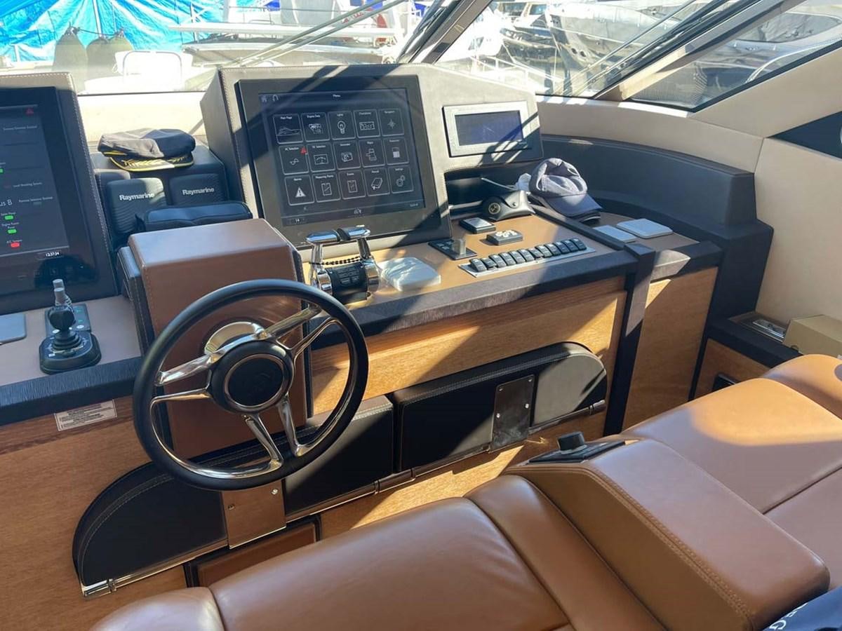 a desk with a computer and other office equipment aboard SKYFALL Yacht for Sale