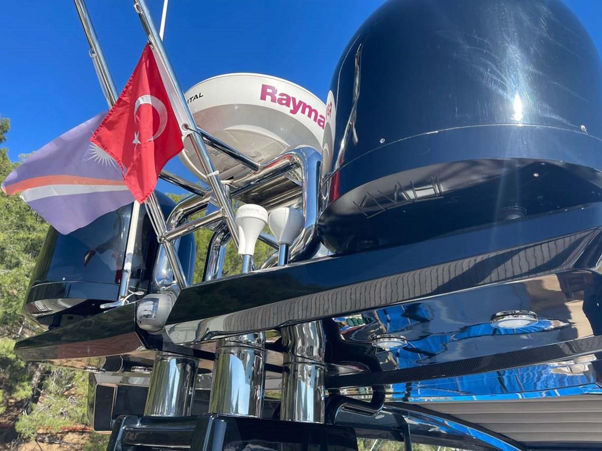 a flag on the hood of a car aboard SKYFALL Yacht for Sale