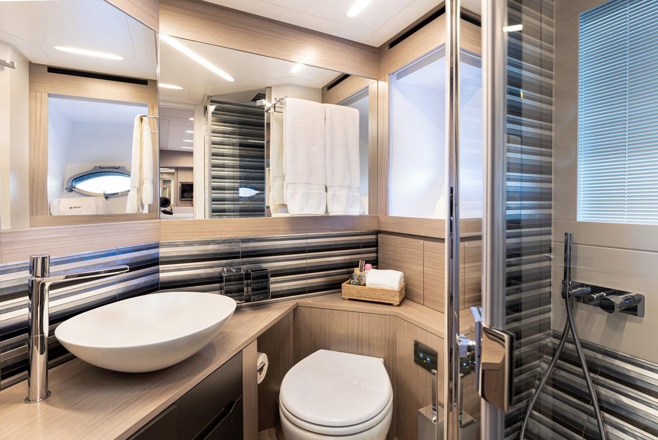 a bathroom with a sink and a shower unit aboard #15 Yacht for Sale