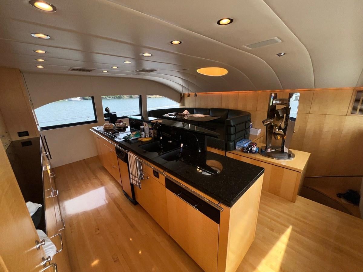 a large kitchen with a large island aboard OREGON MIST Yacht for Sale