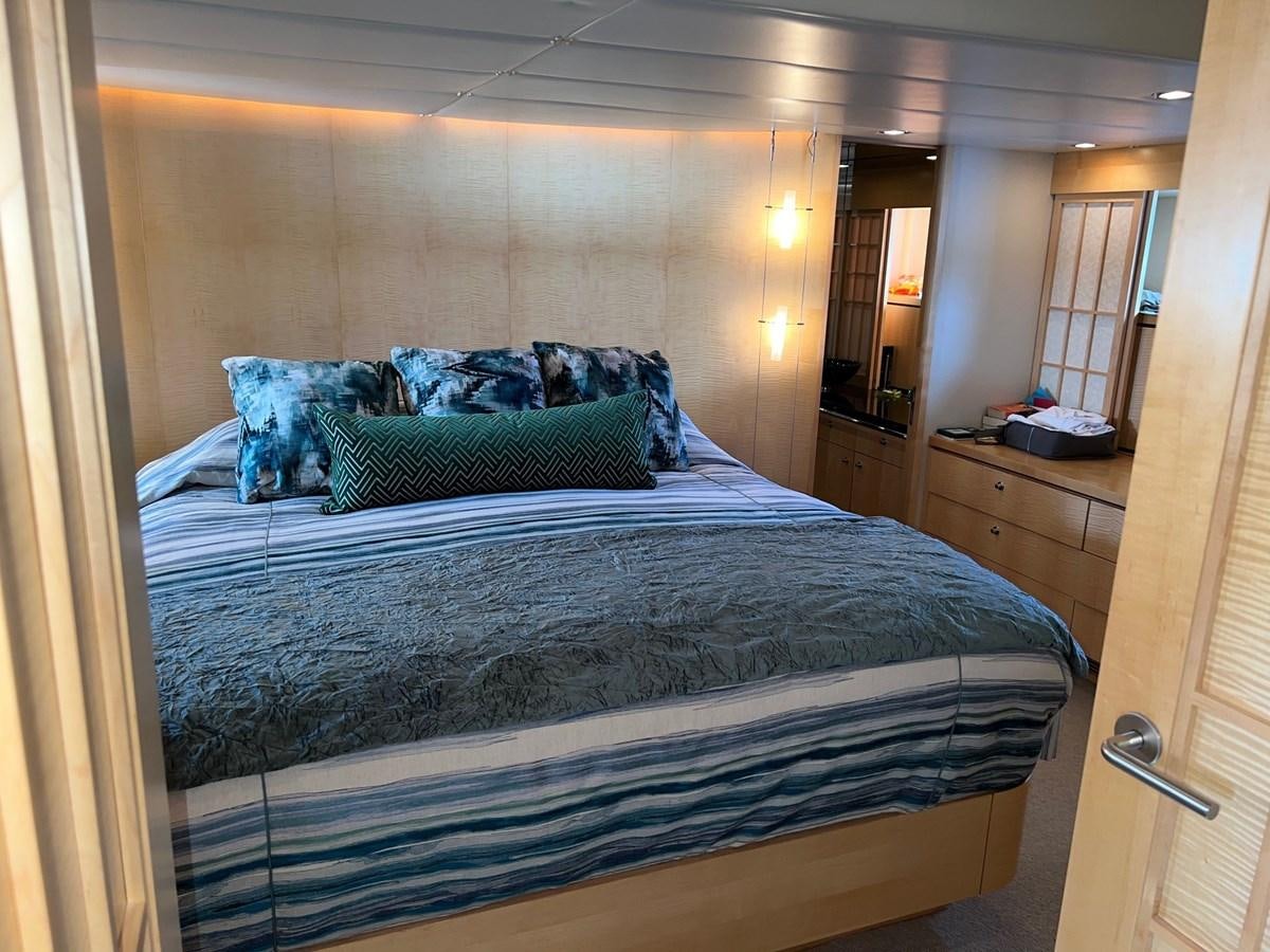 a bed with blue sheets aboard OREGON MIST Yacht for Sale