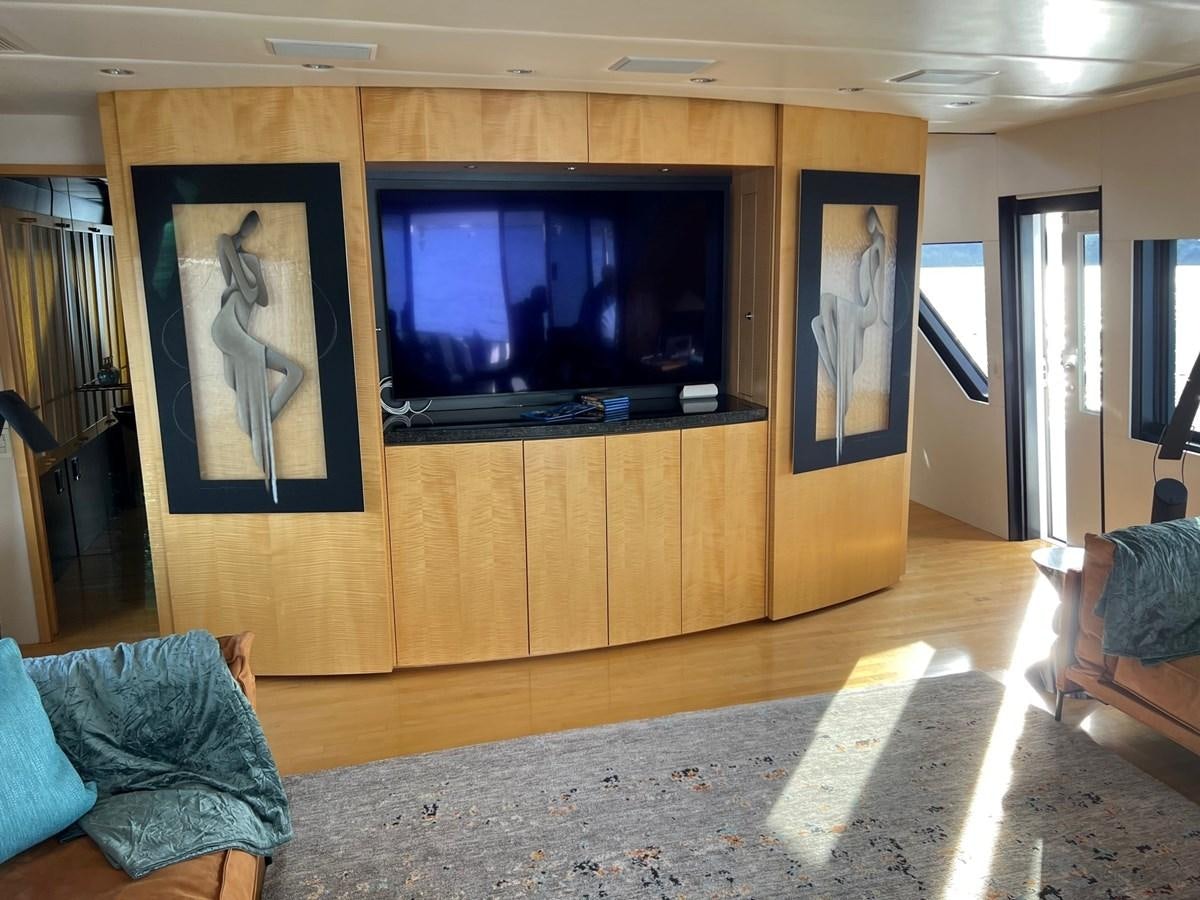a room with a tv and a couch aboard OREGON MIST Yacht for Sale