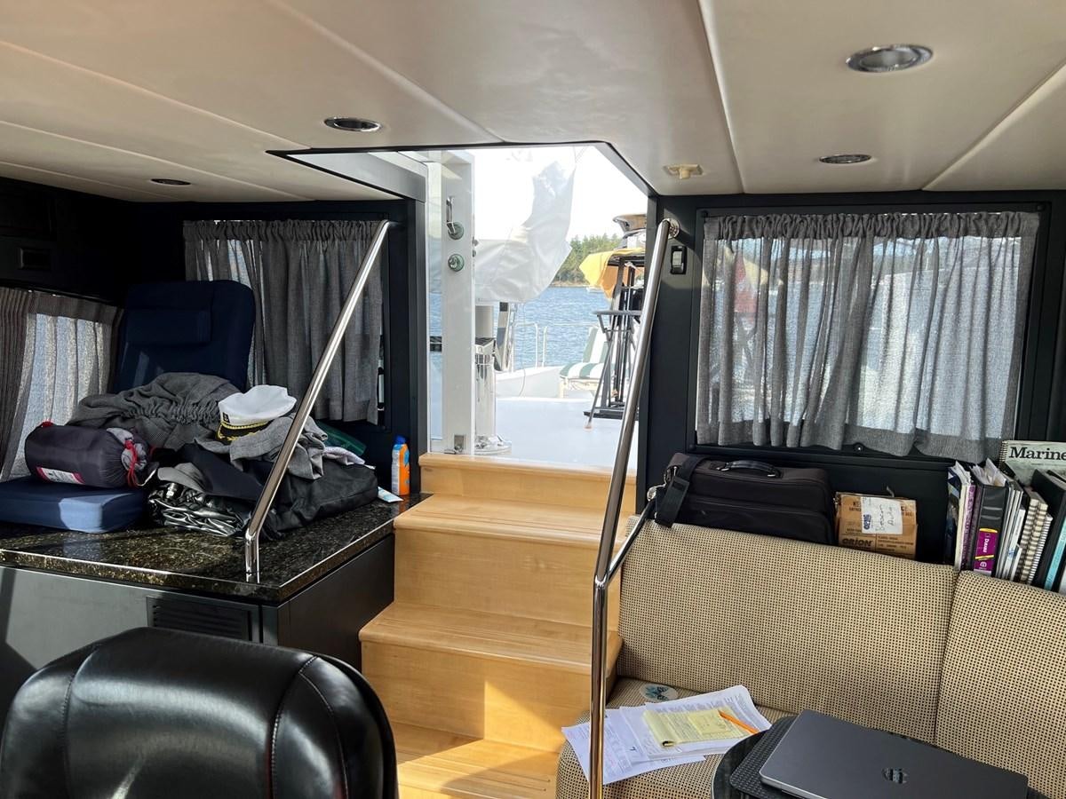 a room with a bed and a desk aboard OREGON MIST Yacht for Sale