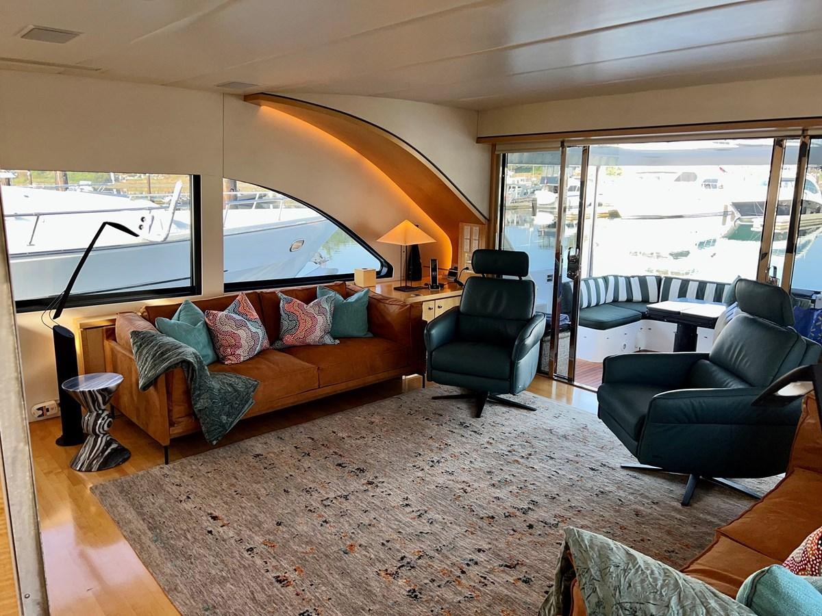 a living room with a large window aboard OREGON MIST Yacht for Sale