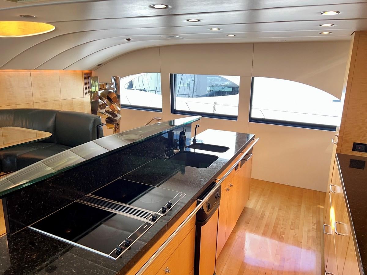 a kitchen with a large island aboard OREGON MIST Yacht for Sale