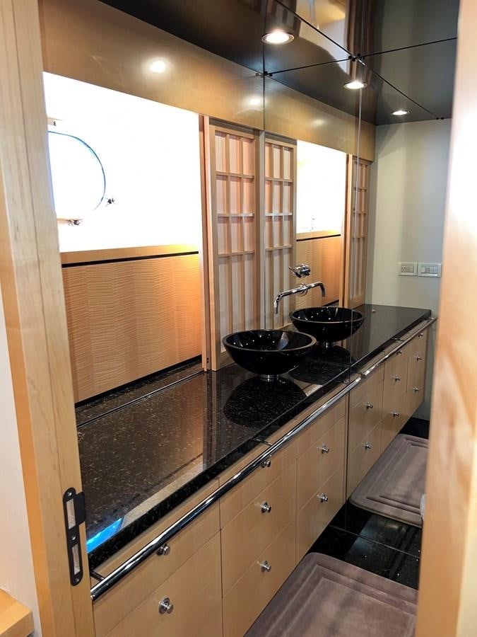 a kitchen with a black counter top aboard OREGON MIST Yacht for Sale