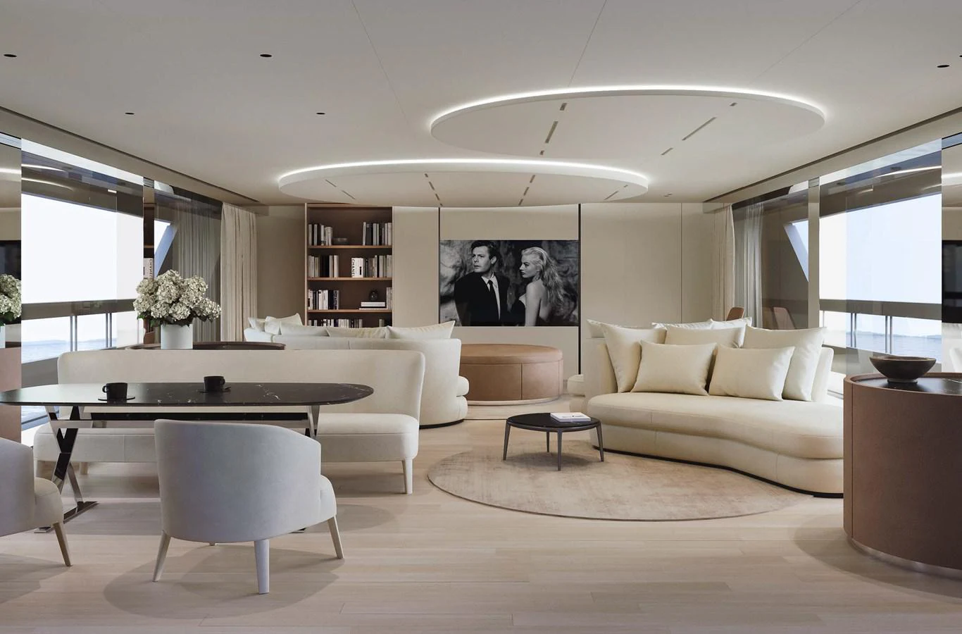 a living room with a large white couch and a large table aboard LORI Yacht for Sale