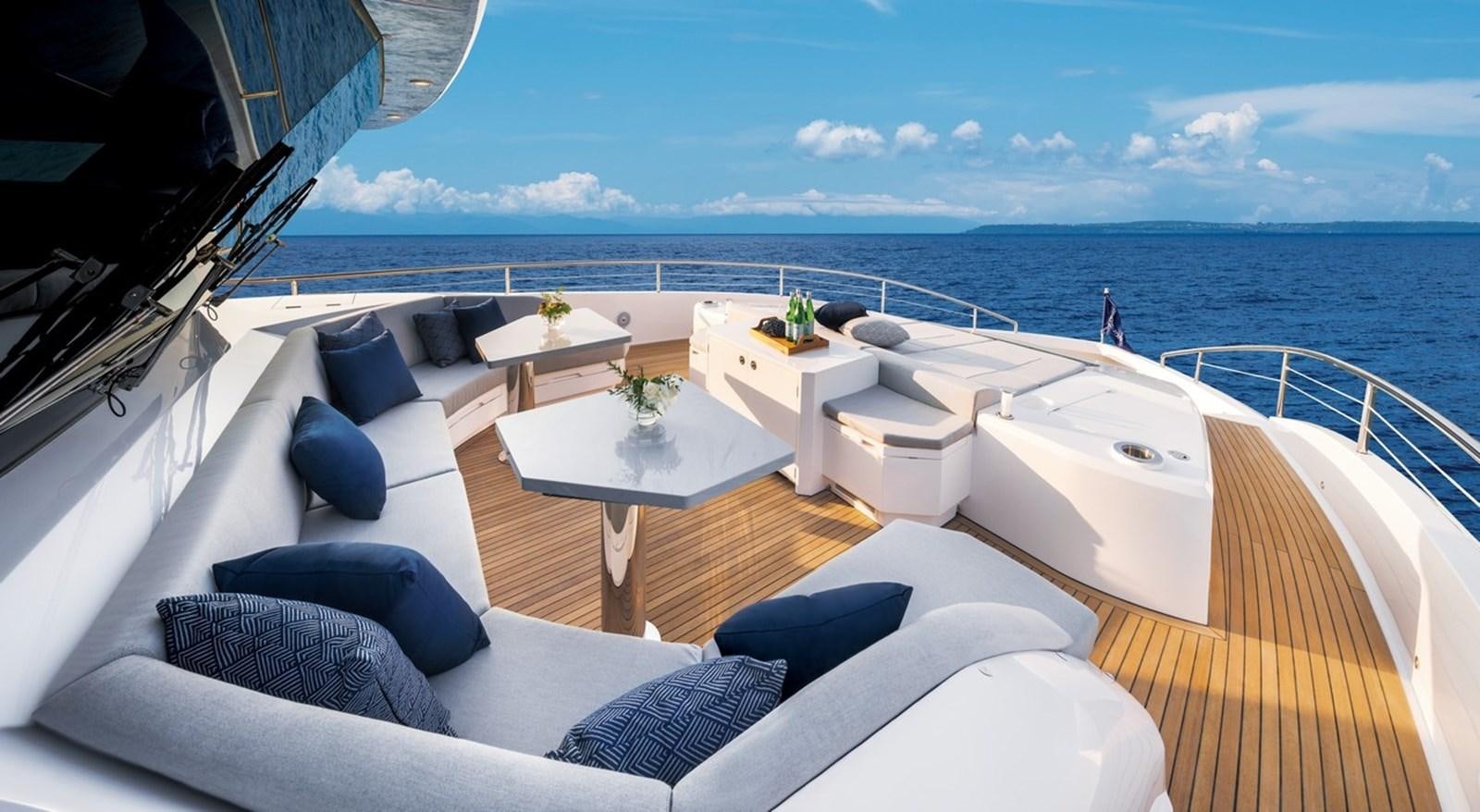 a large white lounge chair on a boat in the ocean aboard HORIZON FD90/30 Yacht for Sale