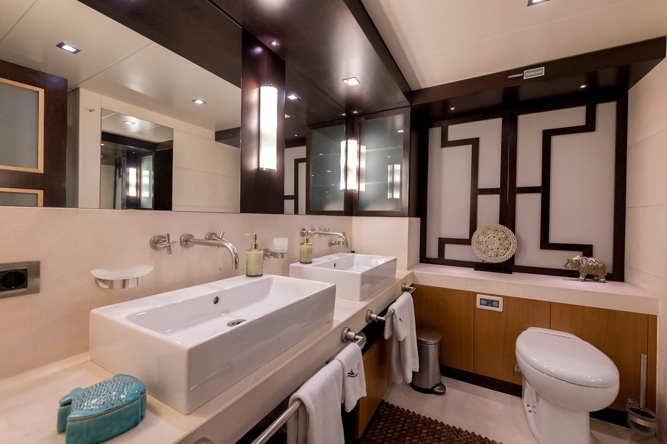 a bathroom with a large mirror aboard SERENITY II Yacht for Sale