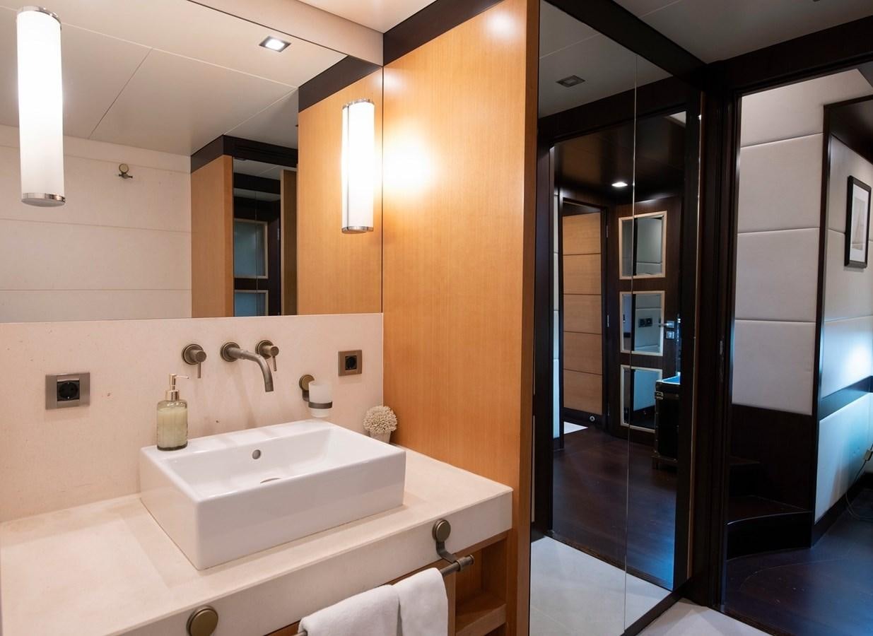 a bathroom with a large mirror aboard SERENITY II Yacht for Sale