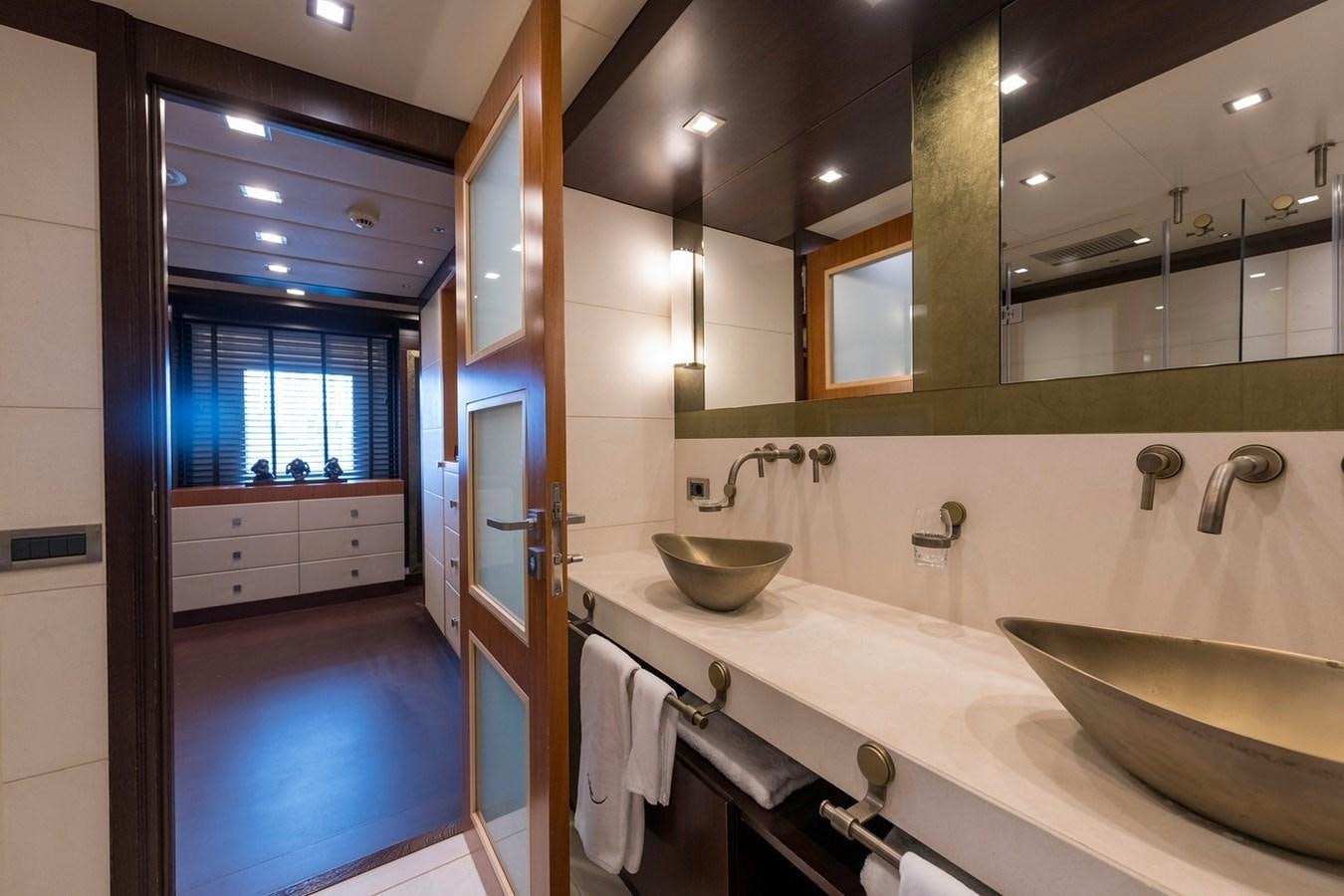 a bathroom with a sink and a mirror aboard SERENITY II Yacht for Sale