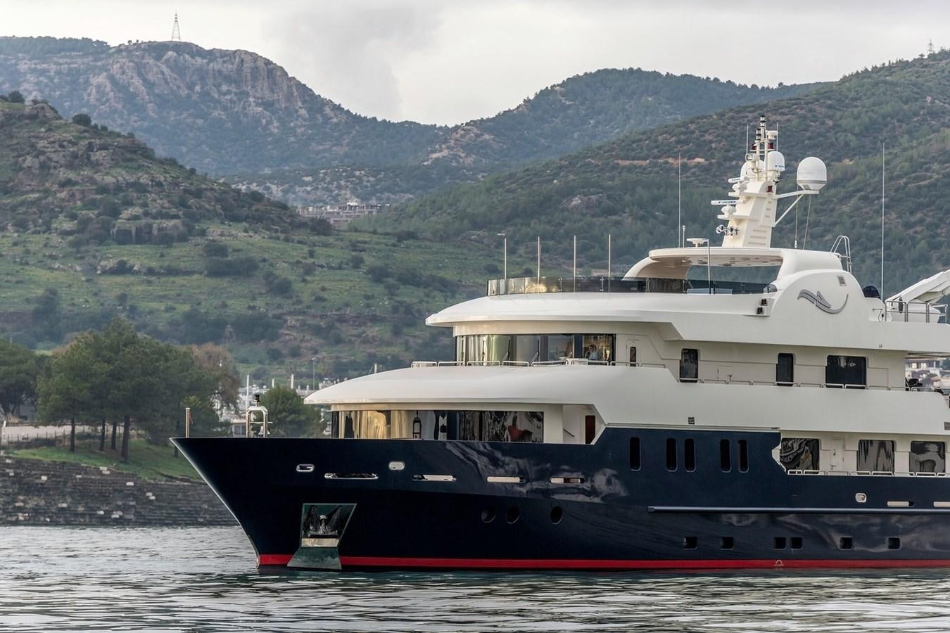 a large boat on the water aboard SERENITY II Yacht for Sale