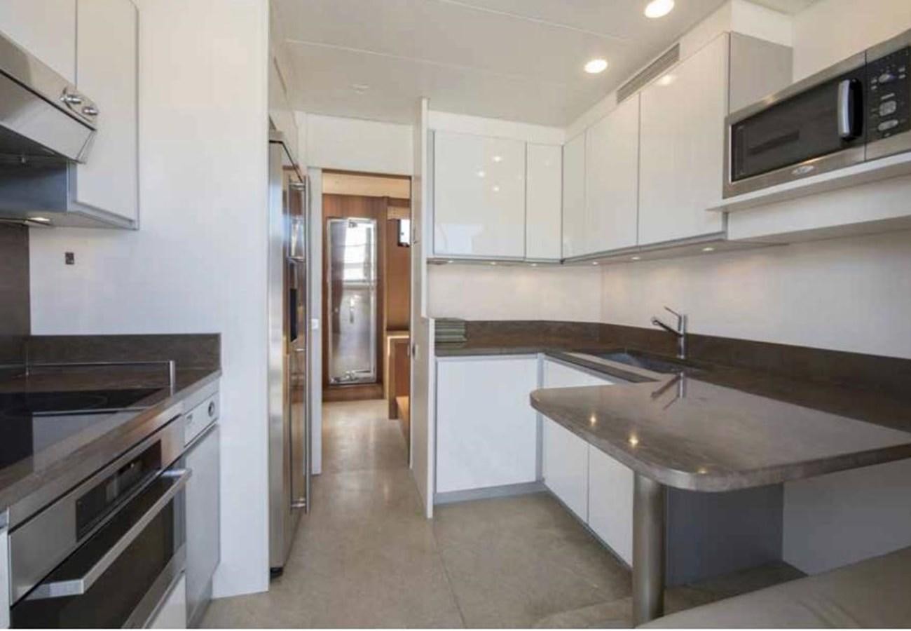 a kitchen with white cabinets aboard MARIS STELLA Yacht for Sale