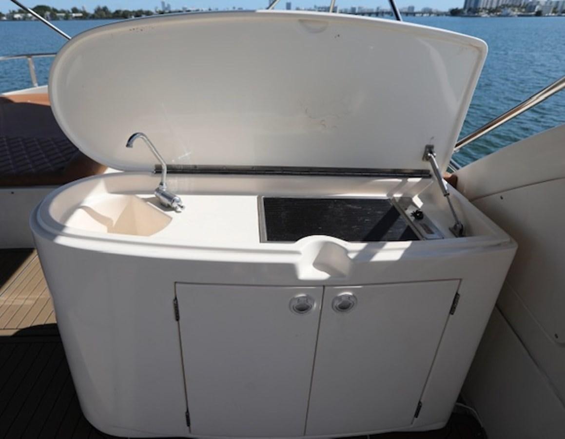 a white boat with a sink aboard K3 Yacht for Sale