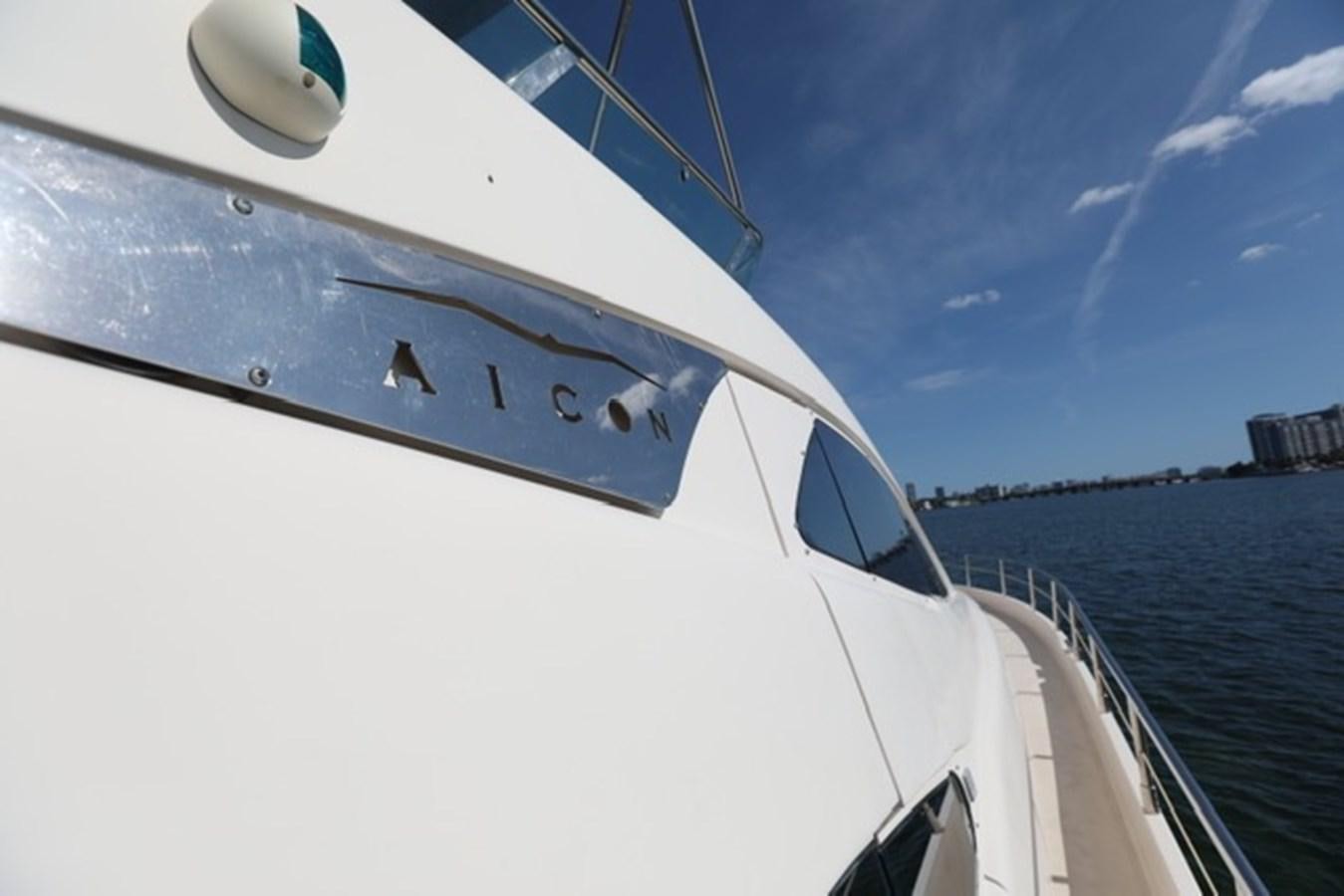 a white boat on a body of water aboard K3 Yacht for Sale