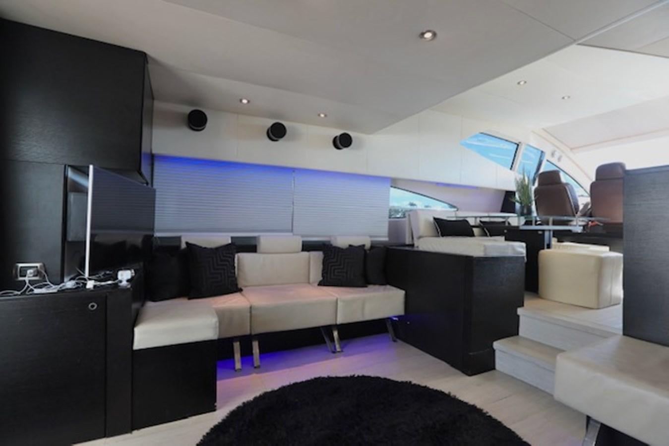 a room with a couch and a tv aboard K3 Yacht for Sale