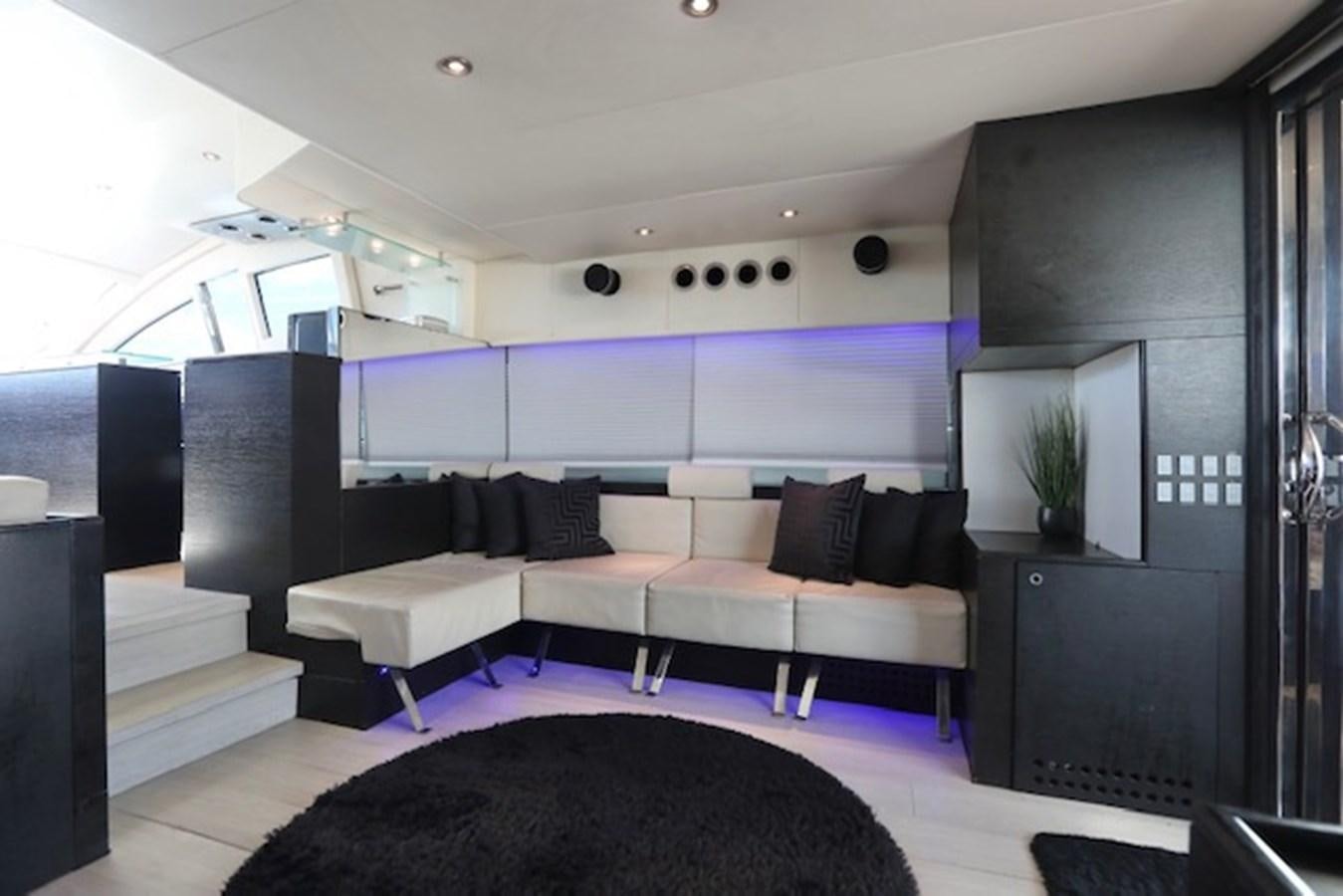 a room with a couch and a tv aboard K3 Yacht for Sale