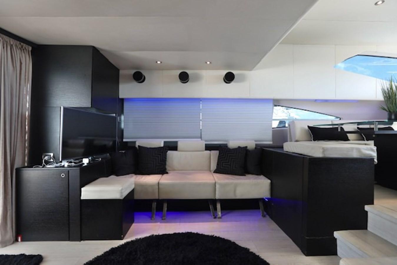 a living room with a couch and a tv aboard K3 Yacht for Sale
