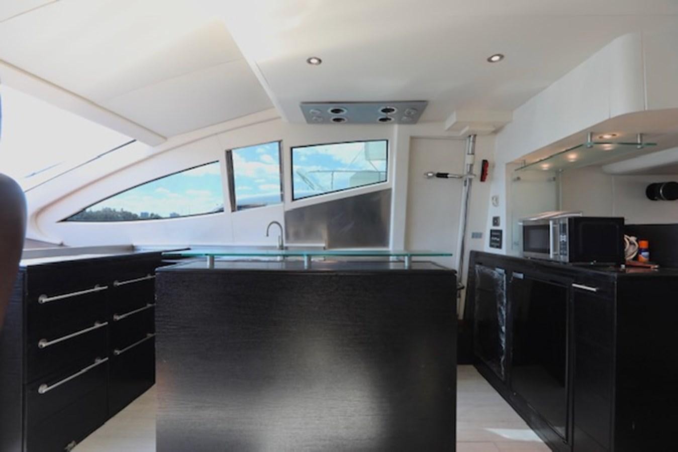 a room with a pool table and a tv aboard K3 Yacht for Sale