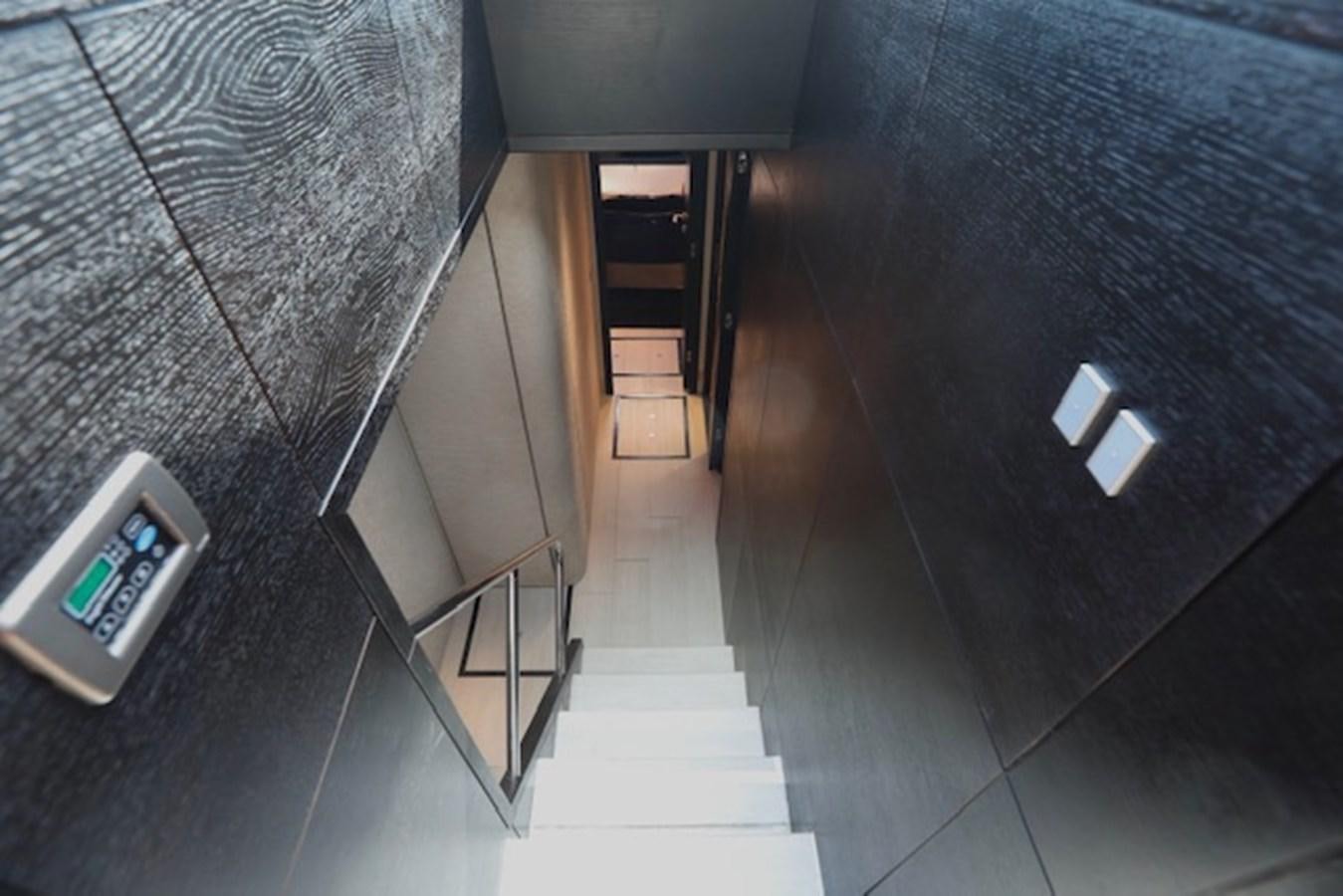 a hallway with a door and a carpet aboard K3 Yacht for Sale