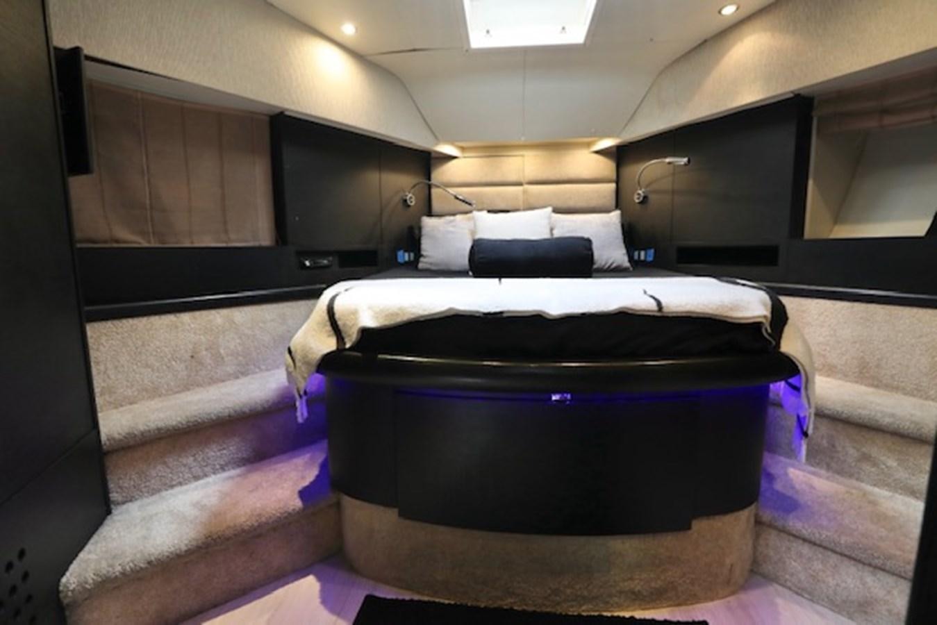 a bed in a room aboard K3 Yacht for Sale