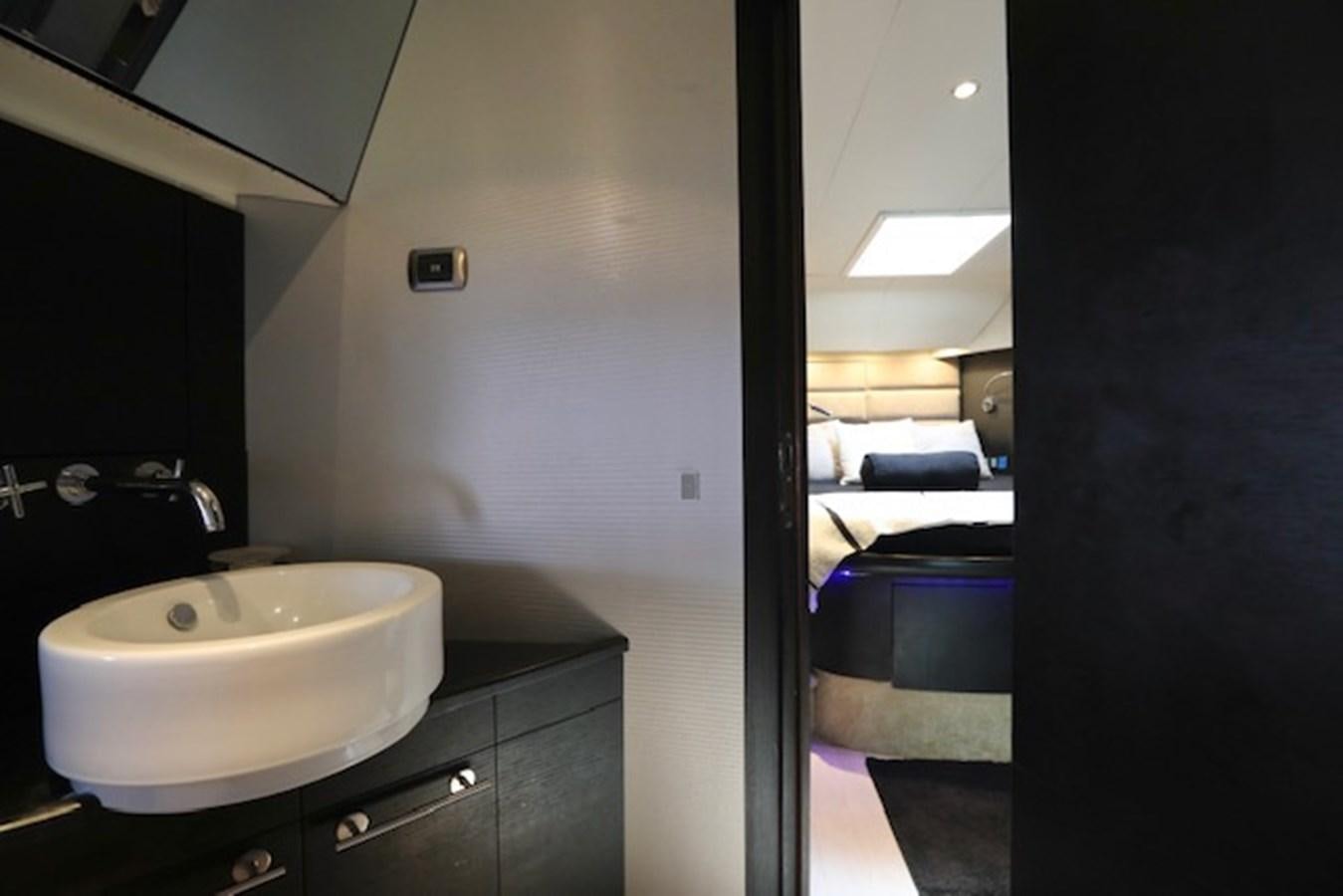 a bathroom with a sink and a mirror aboard K3 Yacht for Sale