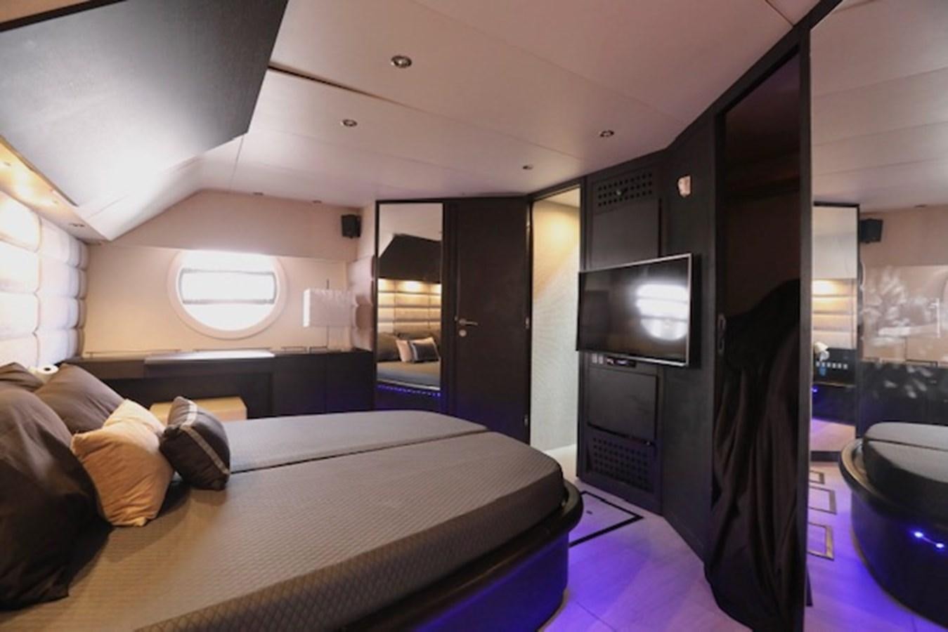 a person lying on a bed aboard K3 Yacht for Sale