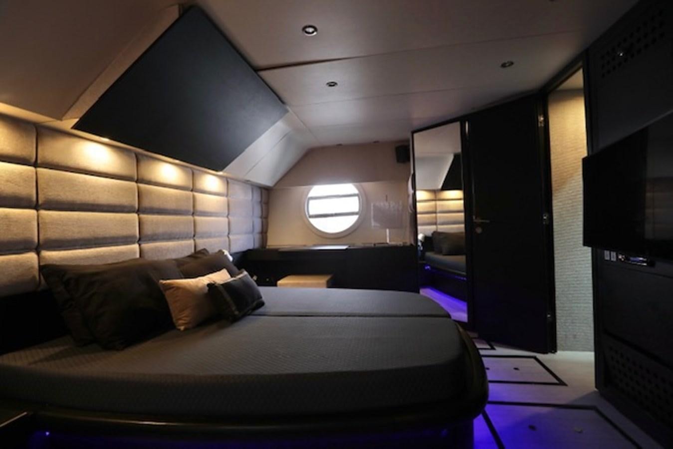 a bed in a room aboard K3 Yacht for Sale