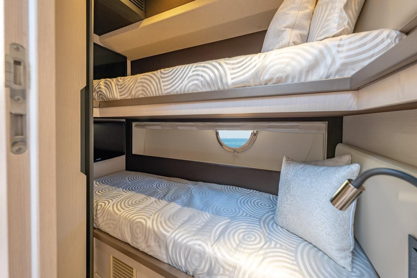 a bed with a blue comforter aboard KNOT DIVORCE Yacht for Sale