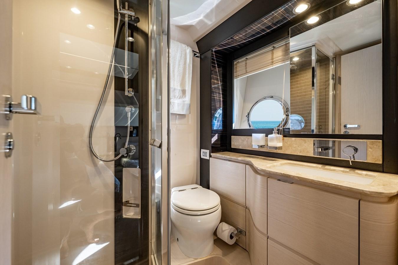 a bathroom with a glass shower aboard KNOT DIVORCE Yacht for Sale